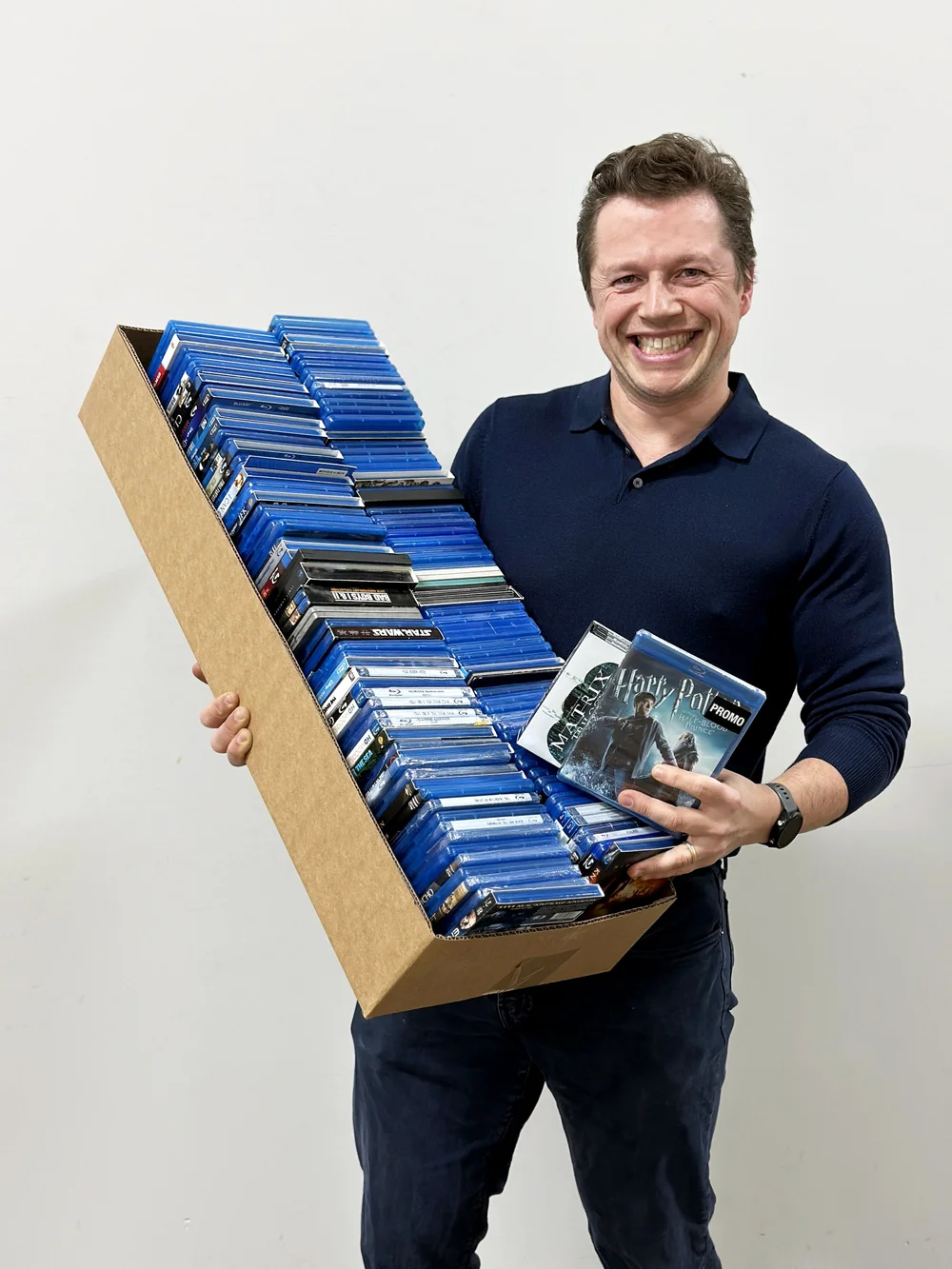 Sean, the DVD king, with a collection